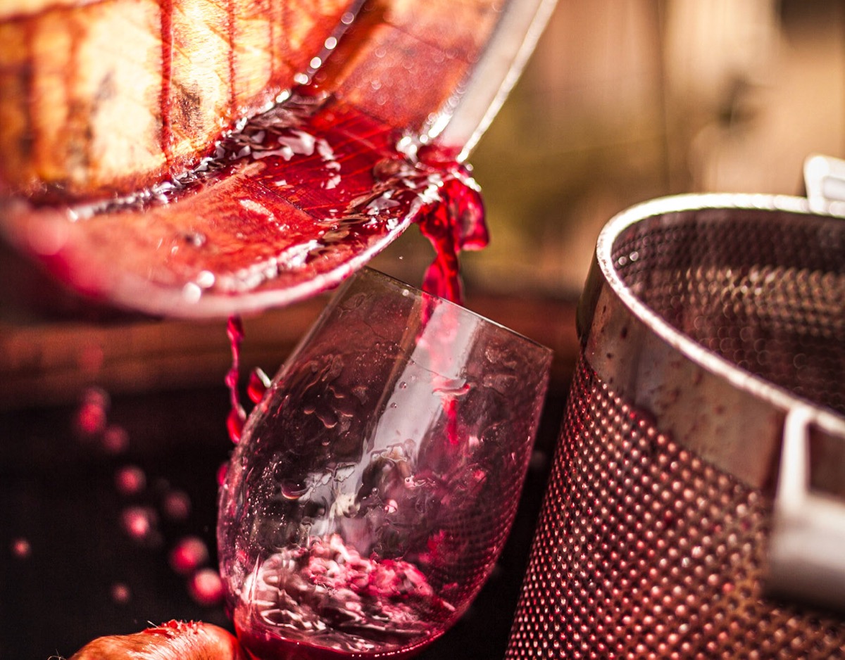 Red wine being pressed during winemaking